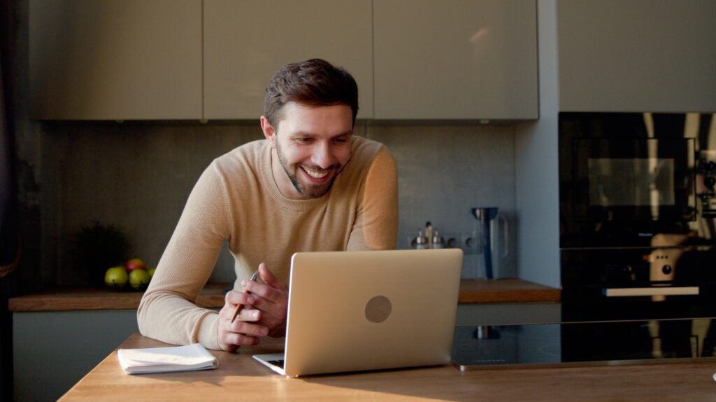 Portrait of young man calling online indoor