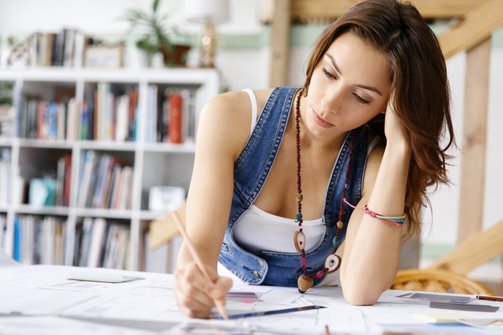 Young pretty woman at her desk
